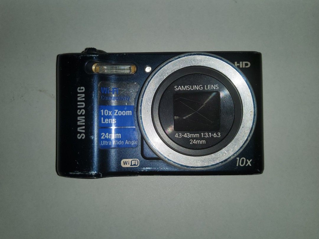 Samsung HD Digital Camera 10x Optical Zoom (Category: Cameras) located in Tuguegarao City. Submitted by yeonlim (Listing ID 1446610332, Image 2). Description: NEGOTIABLE - Samsung HD Digital Camera - 10x Optical Zoom - 24mm Ultra Wide Angle Lens - Built-in Wi-Fi Connectivity - Includes Camera Strap - Ideal for Everyday Photos & Travel • Minor issue is that the battery seems to be old and has to be replaced because sometimes it needs to be charged