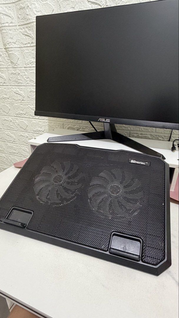 OG Silvertec Laptop Cooler with Dual Fans (Category: Laptops & Notebooks) located in Manila. Submitted by rhinrin (Listing ID 1446593956, Image 2). Description: Original price - 1,100. Selling for 350 - Black laptop cooling pad - Two built-in fans for optimal cooling - USB powered for convenience - Two additional USB ports on the side - Adjustable stand for ergonomic viewing angles - Ideal for extended gaming or work sessions.