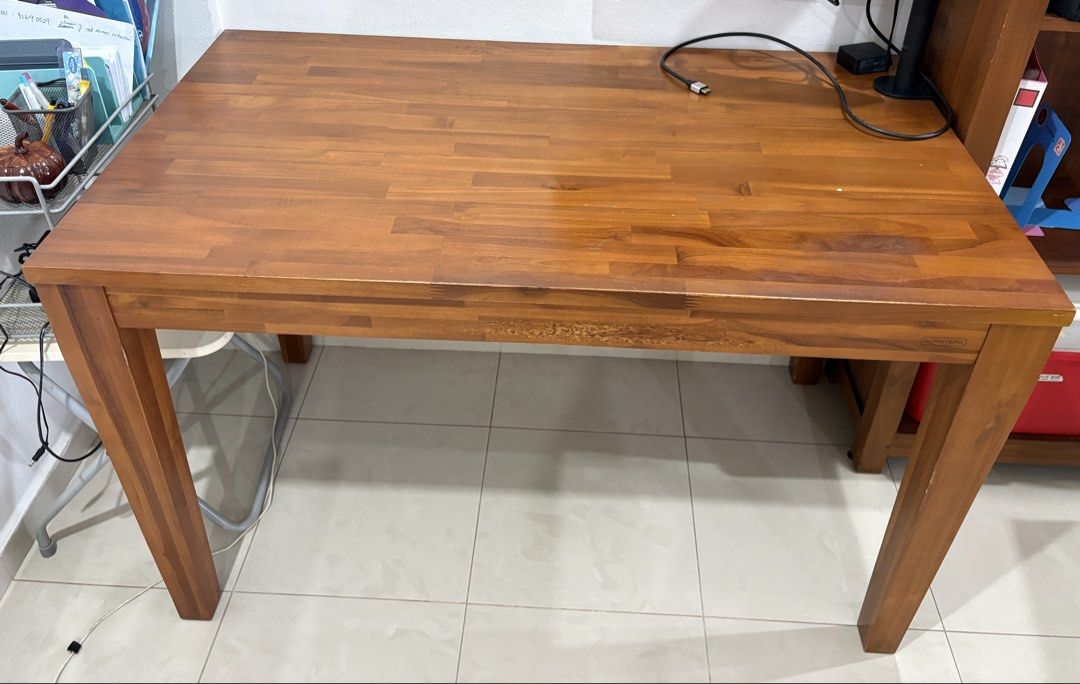 Solid Wood Dining Table / Study Desk (Category: Tables & Sets) located in Singapore. Submitted by calmeagle_7a7a4b (Listing ID 1446569745, Image 2). Description: Scanteak table: - Versatile use: dining table or study desk - Sturdy legs ensure stability - Dimensions: 120cm (L) x 70cm (W) x 75cm (H) - Some scratches on table top and legs.