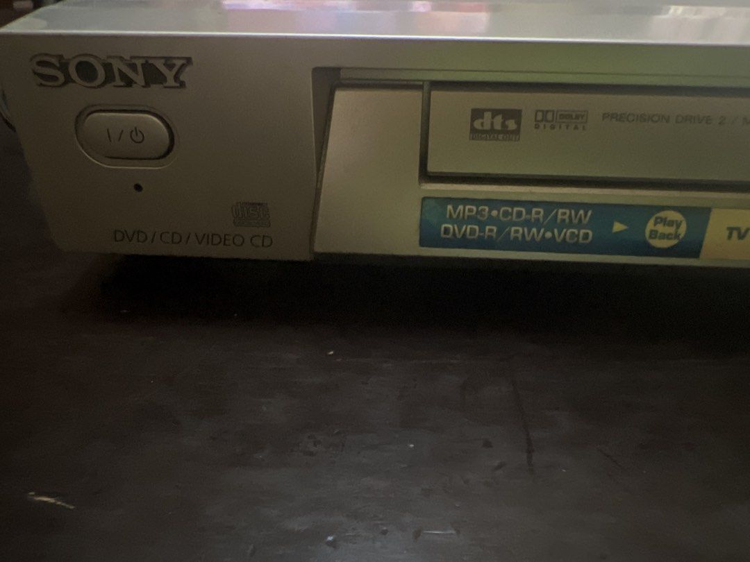 Sony DVD CD Video CD Player Precision Drive 2 for parts (Category: Blu-Ray & Media Players) located in Las Pinas. Submitted by jerri44 (Listing ID 1446568977, Image 2). Description: - Plays DVD, CD, Video CD, and MP3 discs - Features DTS Digital Surround and TV Virtual Surround - Equipped with Precision Drive 2 technology - All connection ports visible in the back photos Note: Trying to test dvd but not loading probably needs head cleaner.