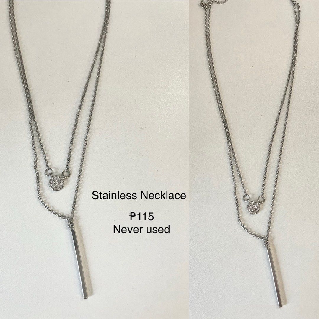 Stainless Steel Layered Necklace (Category: Necklaces) located in Manila. Submitted by hellonuggy (Listing ID 1446605325, Image 2). Description: - Two-layer necklace design - Features a small round pendant with tiny stones - Includes a sleek silver bar pendant - Made of durable stainless steel - Brand new, never used - Versatile for everyday wear or special occasions Rfs: double purchase Loc: commonwealth QC.