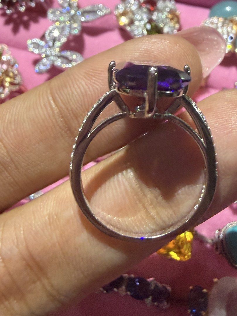 (JULY SALE‼️) Sterling Silver Emerald Cut Amethyst Ring with CZ Accents (Category: Rings) located in Orani. Submitted by kr_bowtique (Listing ID 1446584129, Image 2). Description: - Genuine sterling silver (marked '925') - Features a large, stunning emerald-cut amethyst center stone - Accented with small, brilliant cubic zirconia stones along the band - Versatile for both special occasions and daily wear - A beautiful addition to any jewelry coll