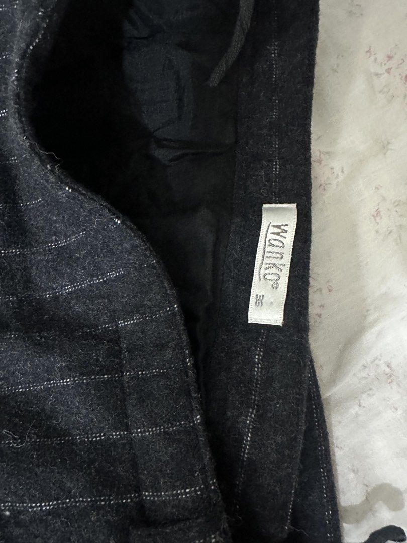 Wanko Pinstripe A-Line Skirt (Category: Skirts) located in Mandaluyong City. Submitted by slickestb (Listing ID 1446639985, Image 2). Description: - Dark grey skirt with white pinstripes - A-line cut - Estimated size 36 - Lined interior - Versatile for work or casual outfits - Classic and simple design.