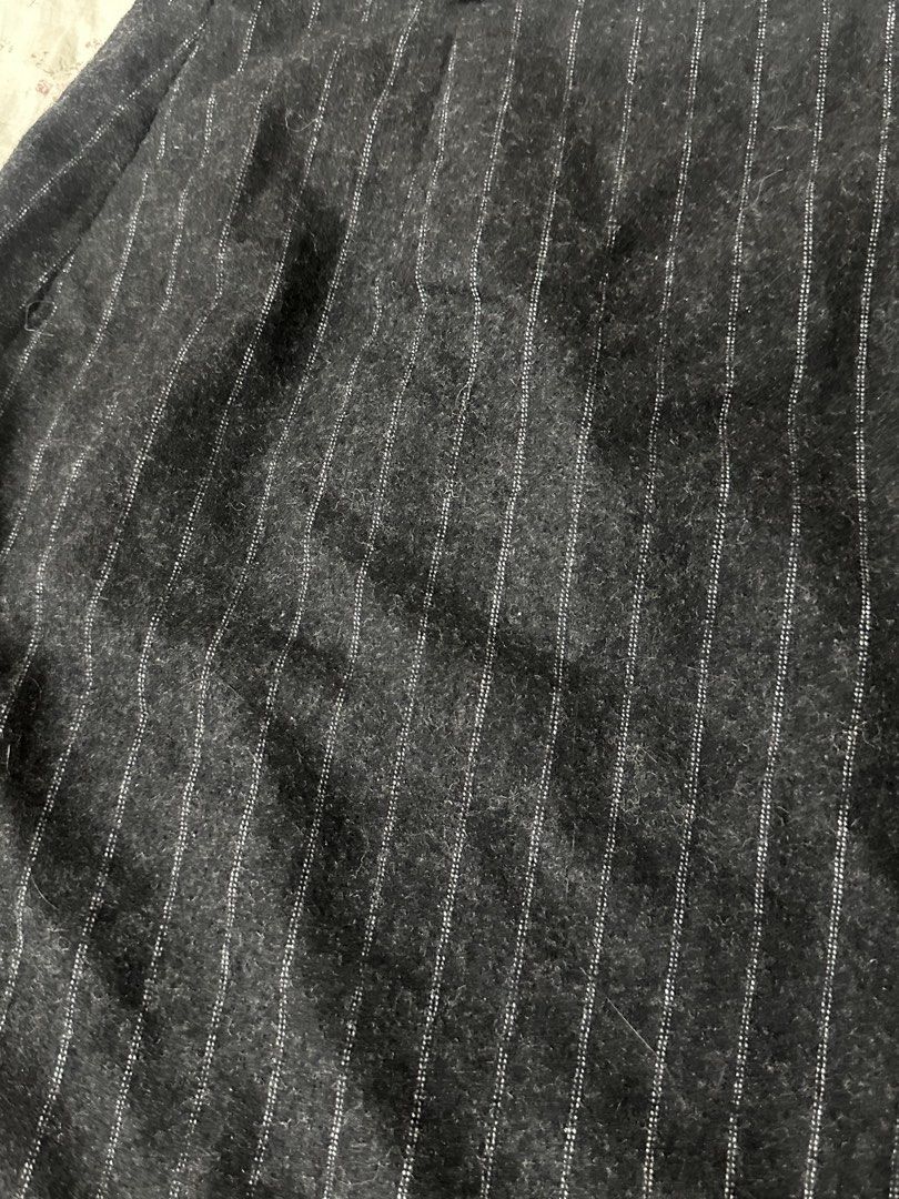 Wanko Pinstripe A-Line Skirt (Category: Skirts) located in Mandaluyong City. Submitted by slickestb (Listing ID 1446639985, Image 3). Description: - Dark grey skirt with white pinstripes - A-line cut - Estimated size 36 - Lined interior - Versatile for work or casual outfits - Classic and simple design.