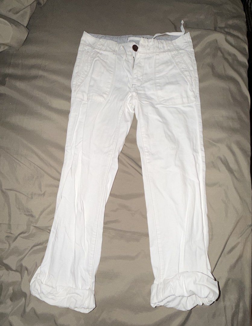 White Cropped Pants Capri (Category: Other Bottoms) located in Quezon City. Submitted by thedevilwearsukay (Listing ID 1446602305, Image 1). Description: - White cropped pants / Capri pants - Button and zip closure - Drawstring waist for adjustable fit - Cuffed hems with button detail - Size 25-26 waist.