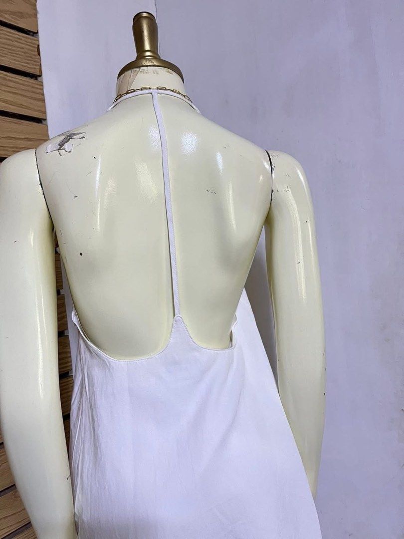 White Halter Neck Maxi Dress (Category: Dresses) located in Iloilo. Submitted by declutterbykid (Listing ID 1446676527, Image 2). Description: - Simple white maxi dress - Halter neck design - Low back detail - Lightweight and flowy fabric - Ideal for beach days or casual outings - Versatile for styling up or down.