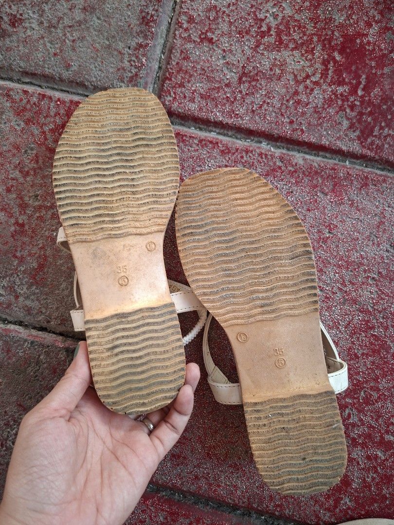 White Strappy Sandals with Elastic Ankle Strap (Category: Flats & Sandals) located in Cavite. Submitted by gette17 (Listing ID 1446538932, Image 2). Description: - Chic white sandals - Multiple thin straps across the foot - Secure elastic strap around the ankle - Comfortable wavy tread sole - Ideal for everyday casual wear - Ready for a new owner! -Delivery fee: Shouldered by the buyer.
