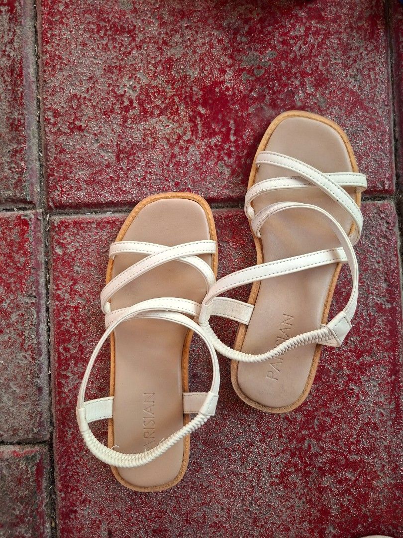 White Strappy Sandals with Elastic Ankle Strap (Category: Flats & Sandals) located in Cavite. Submitted by gette17 (Listing ID 1446538932, Image 1). Description: - Chic white sandals - Multiple thin straps across the foot - Secure elastic strap around the ankle - Comfortable wavy tread sole - Ideal for everyday casual wear - Ready for a new owner! -Delivery fee: Shouldered by the buyer.