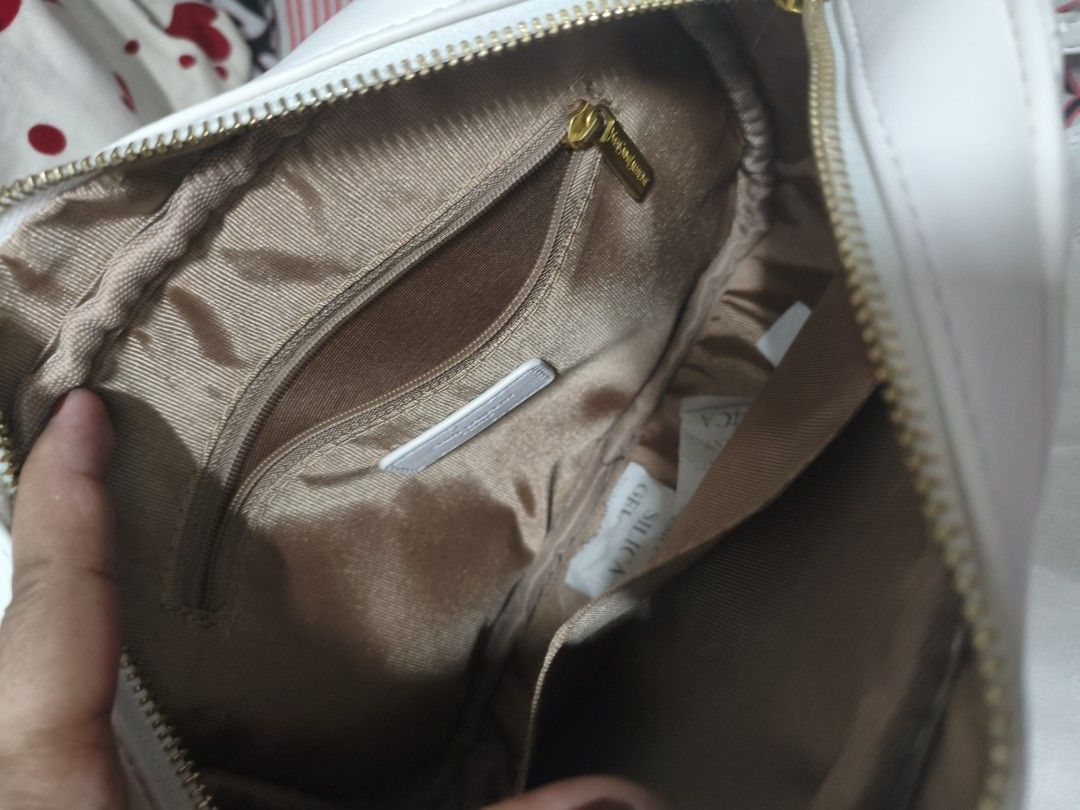 White Yves Saint Laurent Camera Bag (Category: Luxury Bags & Wallets) located in Pateros City. Submitted by arcangel0537529 (Listing ID 1446677003, Image 2). Description: - Authentic White YSL Camera Bag - Elegant Quilted Chevron Pattern - Signature Gold YSL Logo Hardware - Adjustable Strap for Comfort - Interior Zip Pocket and Slip Pocket for Organization - Comes with Original Dust Bag - Ideal for Everyday Use.
