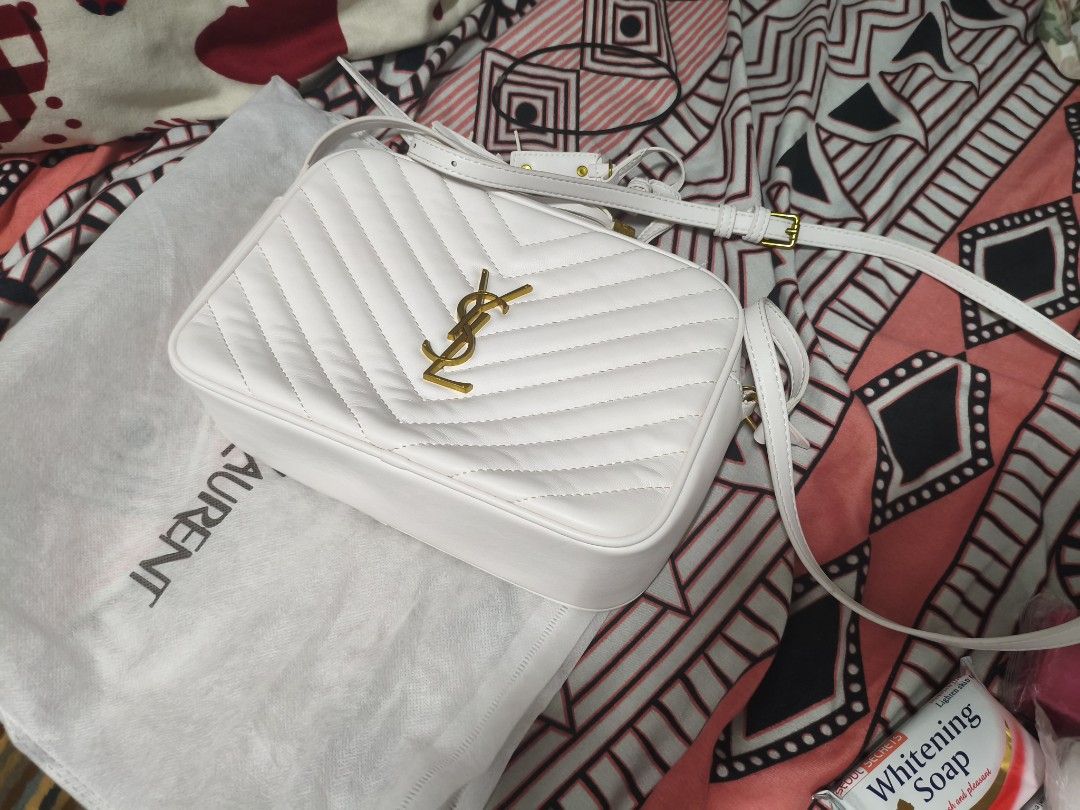 White Yves Saint Laurent Camera Bag (Category: Luxury Bags & Wallets) located in Pateros City. Submitted by arcangel0537529 (Listing ID 1446677003, Image 1). Description: - Authentic White YSL Camera Bag - Elegant Quilted Chevron Pattern - Signature Gold YSL Logo Hardware - Adjustable Strap for Comfort - Interior Zip Pocket and Slip Pocket for Organization - Comes with Original Dust Bag - Ideal for Everyday Use.