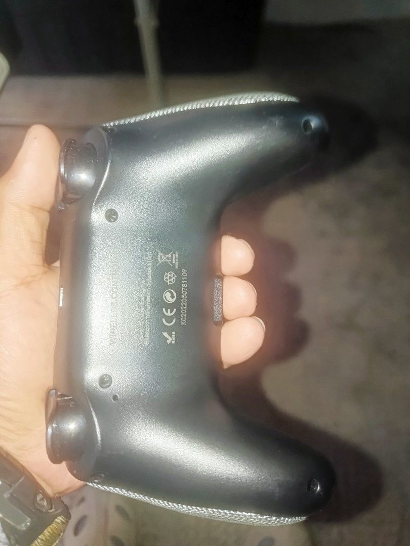 Wireless Controller for PS4 (Category: Controllers) located in Las Pinas. Submitted by avatar23 (Listing ID 1446637658, Image 2). Description: - Black wireless controller - Compatible with PS4 - Textured grips for enhanced handling - All buttons and joysticks fully functional - Minor cosmetic scuffs from normal use - Ready for your next gaming session - las pinas location - can be shipped buyer pays shipping.