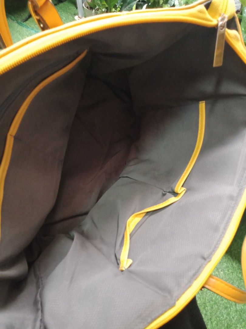 Yellow Canvas Tote Bag with Leather Accents (Category: Tote Bags) located in Manila. Submitted by jessyaveri (Listing ID 1446541576, Image 3). Description: - Durable yellow canvas tote bag - Genuine leather handles and strap details - Secure zipper closure for top access - Interior zippered pocket and slip pocket for organization - Spacious main compartment for all your essentials - Ideal for everyday errands or weekend getaways - Comfortable and