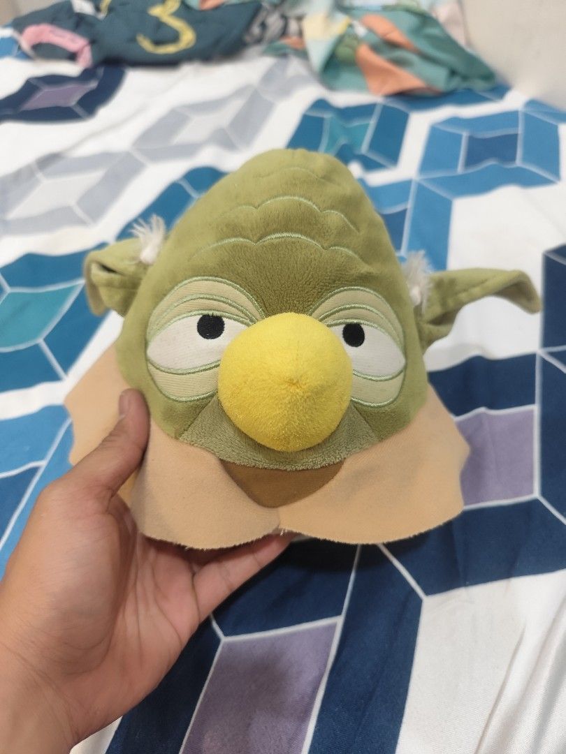 Yoda Plush Toy Hat (Category: Plushies & Soft Toys) located in Manila. Submitted by saint.s (Listing ID 1446630971, Image 1). Description: - Adorable Yoda plush hat, a must-have for Star Wars fans! - Made from soft and cuddly material for ultimate comfort. - Versatile use: great for fun dress-up or as a cool display piece. - Designed to fit most head sizes..