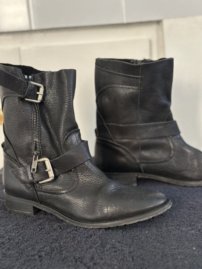 Zara Black Leather Buckle Biker Boots (Category: Boots) located in Batangas. Submitted by enyahsnivl56498 (Listing ID 1446548885, Image 3). Description: - Zara black leather biker boots - Features side buckles and zippers - Low heel for comfortable everyday wear - Shows some signs of wear on soles and leather - Plenty of life left for continued use.