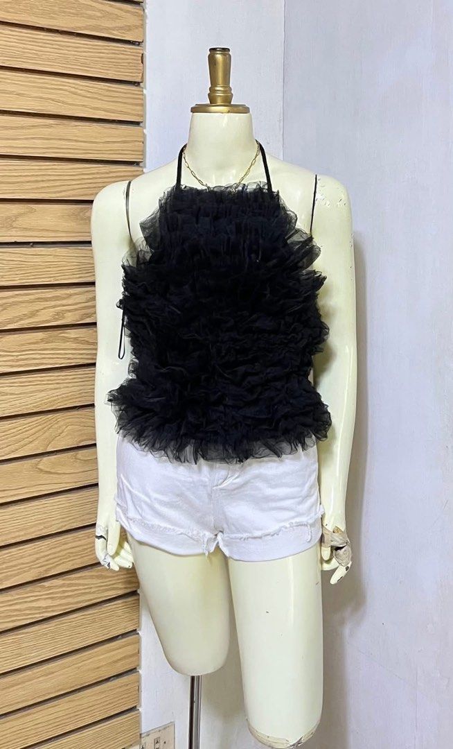 Zara Black Tulle Ruffle Halter Neck Top (Category: Sleeveless) located in Iloilo. Submitted by declutterbykid (Listing ID 1446676800, Image 1). Description: - Zara black halter neck top - Features voluminous tulle ruffles all over - Ties at the back of the neck - Super cute and fun design - Ideal for night outs or special occasions - Versatile: pair with jeans or a skirt.