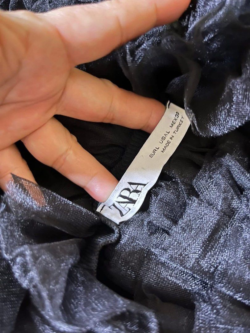 Zara Black Tulle Ruffle Halter Neck Top (Category: Sleeveless) located in Iloilo. Submitted by declutterbykid (Listing ID 1446676800, Image 2). Description: - Zara black halter neck top - Features voluminous tulle ruffles all over - Ties at the back of the neck - Super cute and fun design - Ideal for night outs or special occasions - Versatile: pair with jeans or a skirt.