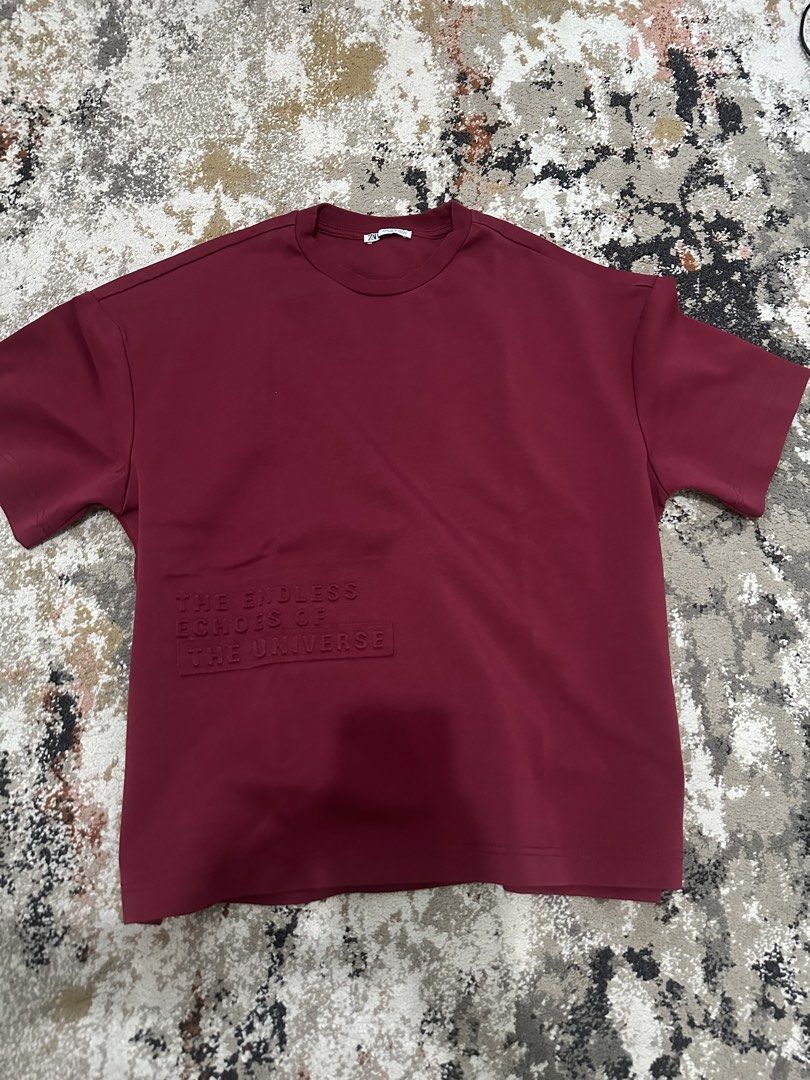 ZARA Burgundy Sweatshirt with Embossed Text - Small (Category: Tshirts & Polo Shirts ) located in Quezon City. Submitted by closetrm131 (Listing ID 1446618107, Image 2). Description: - Brand: ZARA - Color: Burgundy - Design: Embossed text on front: 'THE ENDLESS ECHOES OF THE UNIVERSE' - Sleeves: Short - Neckline: Crew neck - Material: Made in Turkey - Size: S (EUR S, USAS M) - Style: Casual wear.