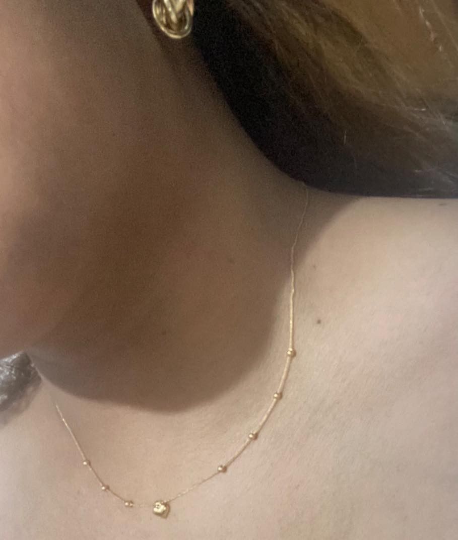 18k saudi gold necklace (Category: Necklaces) located in Manila. Submitted by leilei.shopmore (Listing ID 1441619012, Image 2). Description: - Delicate 18k saudi gold necklace _size 18 0.7grams - Features a small heart pendant - Tiny gold beads spaced along the chain - Secure clasp closure - Lightweight and dainty design - Ideal for layering or solo wear.