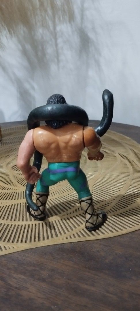 1991 Hasbro WWF Jake The Snake Roberts (Category: Action & Battle Toys) located in Manila. Submitted by ventajetoyz625 (Listing ID 1441722762, Image 3). Description: - Vintage Jake 'The Snake' Roberts wrestling figure - Hasbro version from the WWF era - Includes customized signature snake accessory (resin material) - Perfect for wrestling collectors and memorabilia enthusiasts - "Gimmick" not working.