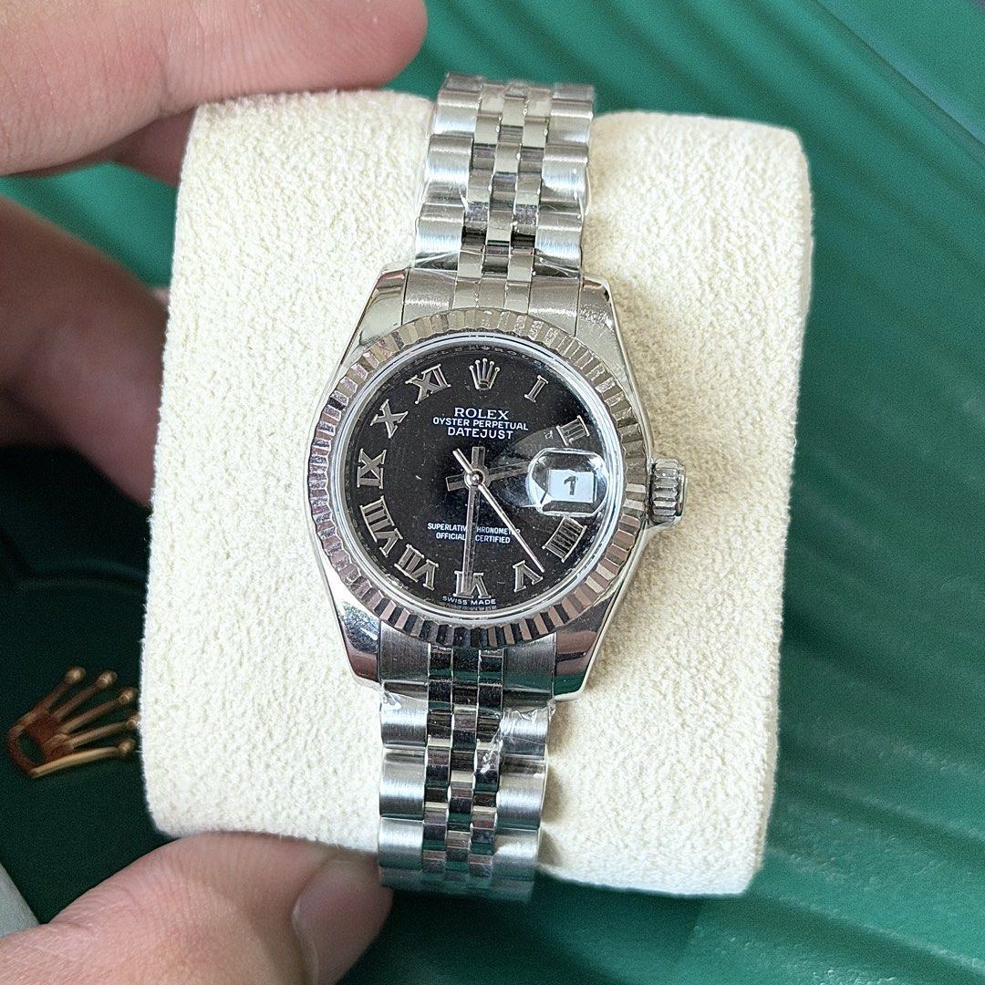 2011 Rolex Datejust 26 Black Roman Dial (Category: Luxury Watches) located in Paranaque City. Submitted by adom21 (Listing ID 1441689081, Image 2). Description: FOR SALE OR TRADE ⌚️🪹 2011 Rolex Datejust 26 Black Roman Dial Ref 179174 9.8/10 Pristine Condition Local AD 2011 26mm case size with 21 links Double Box, Manuals, Guarantee Card, Hangtags Price: P418,000 Negotiable Meetups and viewing by appointment. Open for viewing in greenhills. Faceb