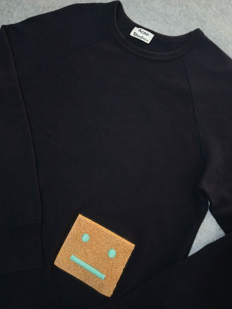 Acne Studios Navy Crewneck Sweatshirt with Face Patch (Category: Luxury Apparel) located in Manila. Submitted by highsobriety.co (Listing ID 1441666792, Image 3). Description: Authentic Face Patch Crewneck in Bluish Gray — signature minimalist icon from the Swedish label 20 x 25.5 in S on tag Very good condition No issues Items are pre-owned. Not affiliated with featured brands..