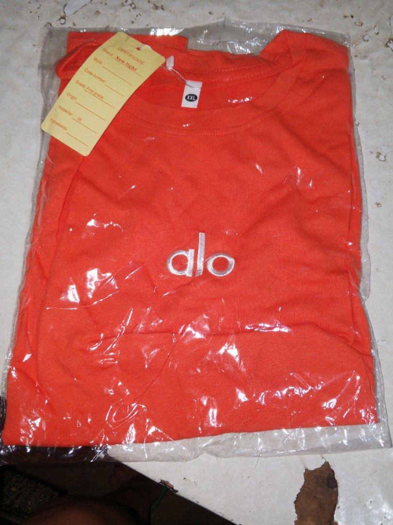 Alo Orange T-shirt (Category: Tshirts & Polo Shirts ) located in Davao. Submitted by soybean17 (Listing ID 1441644723, Image 1). Description: - Brand: Alo - Color: Orange - Size: XL - Condition: Brand new, with original packaging and tag attached - Ideal for: Casual wear, workouts, or active lifestyle.