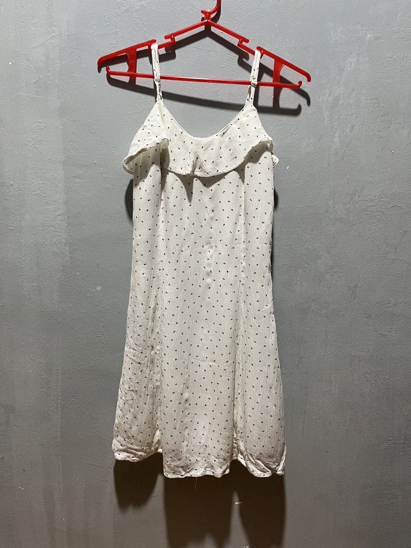 American Eagle White Mini Floral Dress (Category: Dresses) located in Taguig. Submitted by ls_ln (Listing ID 1441625599, Image 1). Description: - Cute white dress - Small black floral pattern - Ruffled neckline - Thin straps - Lightweight fabric, ideal for warm weather - Ideal for casual or beach wear - Size: XS-S - ww available (pm).