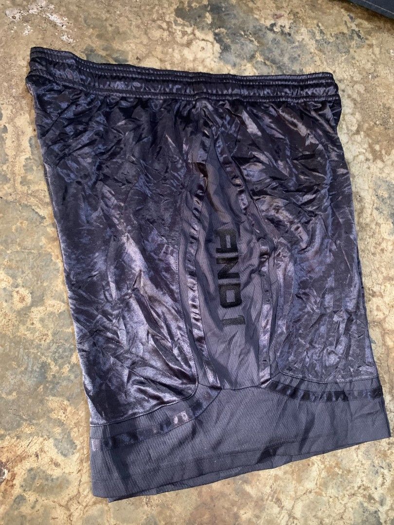 AND1 Black Basketball Shorts (Category: Shorts) located in Davao. Submitted by asrielthrift (Listing ID 1441744487, Image 1). Description: - Shiny AND1 basketball shorts - Printed AND1 logo on the side - Comfortable elastic waistband - Mesh panel at the bottom hem - Ideal for basketball or casual wear.