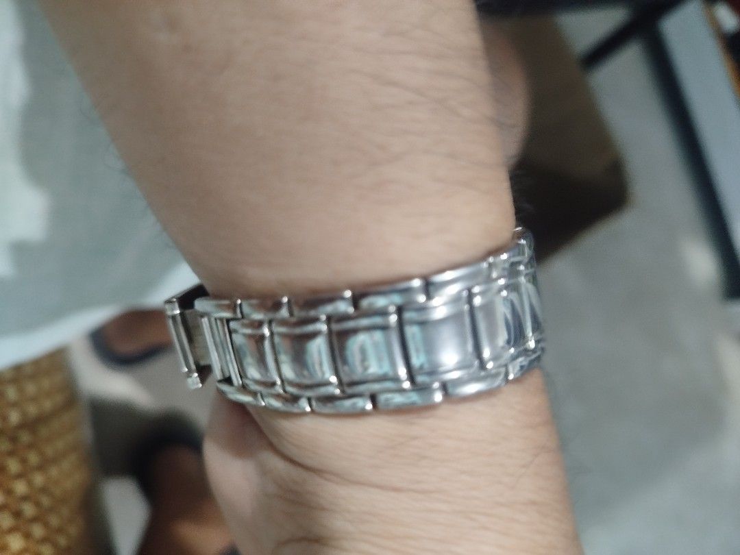 Anne Klein Women's Rectangular Stainless Steel Watch (Category: Women's Watches) located in Subic. Submitted by regiedaniel01 (Listing ID 1441704232, Image 3). Description: Anne Klein watch for women. Silver-tone stainless steel band and rectangular case. The dial is a light grey with silver-tone hour markers and hands. Japan movt quartz movement. Base metal bezel, stainless steel back. Some minor signs of wear on the band and case. A classic tim