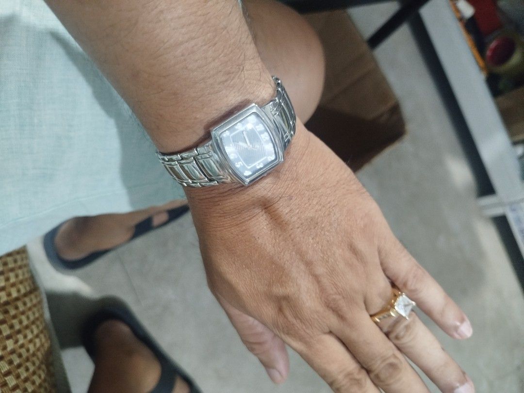 Anne Klein Women's Rectangular Stainless Steel Watch (Category: Women's Watches) located in Subic. Submitted by regiedaniel01 (Listing ID 1441704232, Image 1). Description: Anne Klein watch for women. Silver-tone stainless steel band and rectangular case. The dial is a light grey with silver-tone hour markers and hands. Japan movt quartz movement. Base metal bezel, stainless steel back. Some minor signs of wear on the band and case. A classic tim