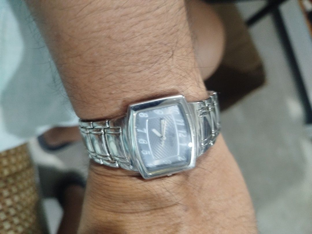 Anne Klein Women's Rectangular Stainless Steel Watch (Category: Women's Watches) located in Subic. Submitted by regiedaniel01 (Listing ID 1441704232, Image 2). Description: Anne Klein watch for women. Silver-tone stainless steel band and rectangular case. The dial is a light grey with silver-tone hour markers and hands. Japan movt quartz movement. Base metal bezel, stainless steel back. Some minor signs of wear on the band and case. A classic tim