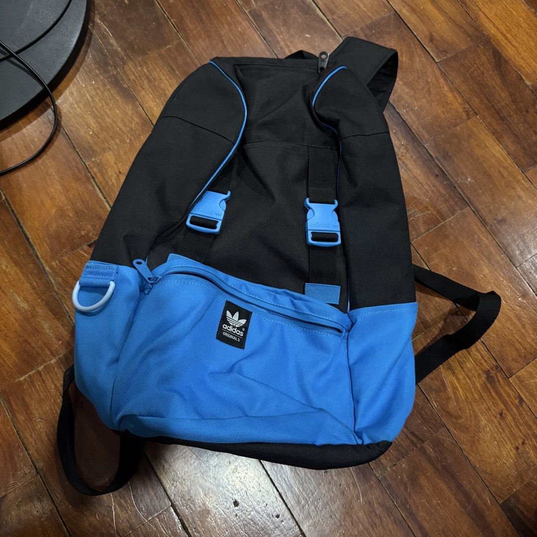 Authentic Adidas Originals Backpack Black Blue (Category: Backpacks) located in Quezon City. Submitted by kb0030 (Listing ID 1441688478, Image 1). Description: - Adidas Originals backpack - Color: Black with blue accents - Front zip pocket with iconic Adidas logo - Adjustable straps for comfortable wear - Spacious main compartment for all your essentials - Ideal for school, work, or everyday adventures.