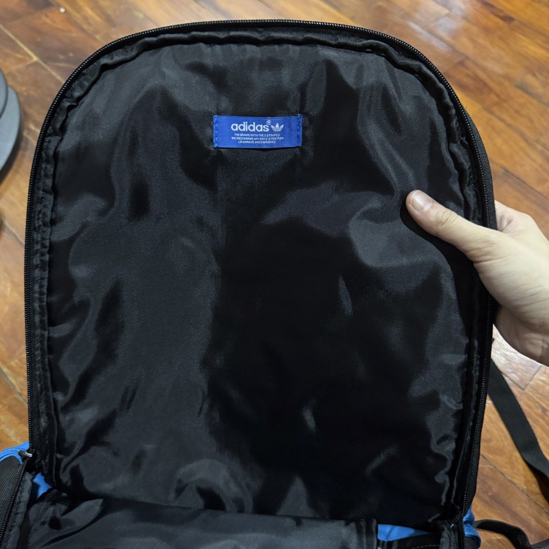 Authentic Adidas Originals Backpack Black Blue (Category: Backpacks) located in Quezon City. Submitted by kb0030 (Listing ID 1441688478, Image 3). Description: - Adidas Originals backpack - Color: Black with blue accents - Front zip pocket with iconic Adidas logo - Adjustable straps for comfortable wear - Spacious main compartment for all your essentials - Ideal for school, work, or everyday adventures.