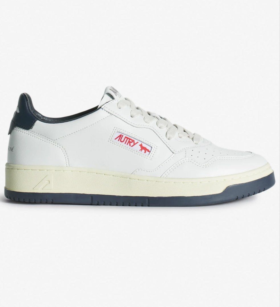 Autry Maison Kitsune Shoes Medalist Sneakers White (Category: Casual Shoes) located in Pasig City. Submitted by thetravellingguyinstyle (Listing ID 1441756340, Image 3). Description: - Classic white leather sneakers by Autry x Maison Kitsune - White Sneakers, Navy blue accents on heel tab and sole - Perforated toe box for breathability - Secure lace-up closure - Comfortable and stylish for everyday wear - Complete with box - Guaranteed Authentic 