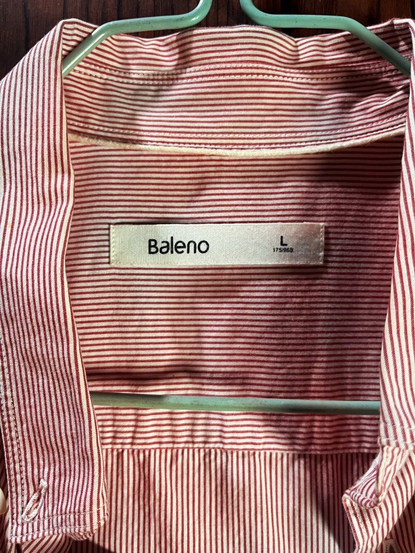 Baleno Pink Striped Button-Up Shirt (Category: Shirts) located in Manila. Submitted by chiyooo787 (Listing ID 1441758055, Image 3). Description: 26L by 20W Brand: Baleno Size: M Color rate: 9/10 Issue: small yellow and pink stains in right sleeves but not noticeable rfs: not my size anymore but would love to keep it since it looks cutesy +sf for buyers.