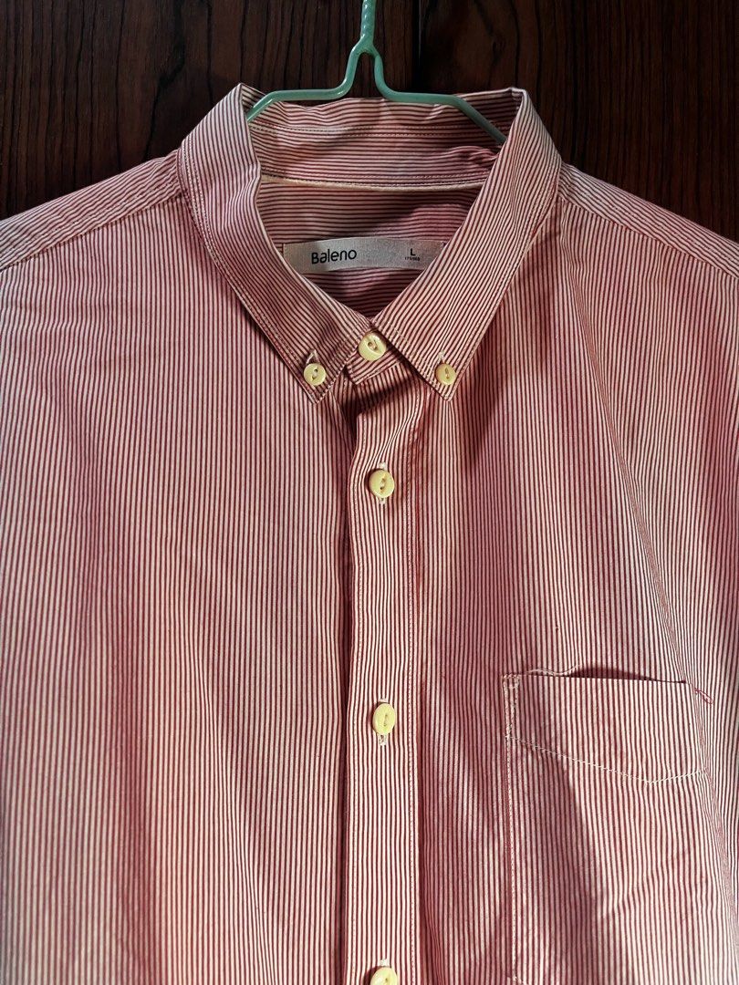 Baleno Pink Striped Button-Up Shirt (Category: Shirts) located in Manila. Submitted by chiyooo787 (Listing ID 1441758055, Image 2). Description: 26L by 20W Brand: Baleno Size: M Color rate: 9/10 Issue: small yellow and pink stains in right sleeves but not noticeable rfs: not my size anymore but would love to keep it since it looks cutesy +sf for buyers.