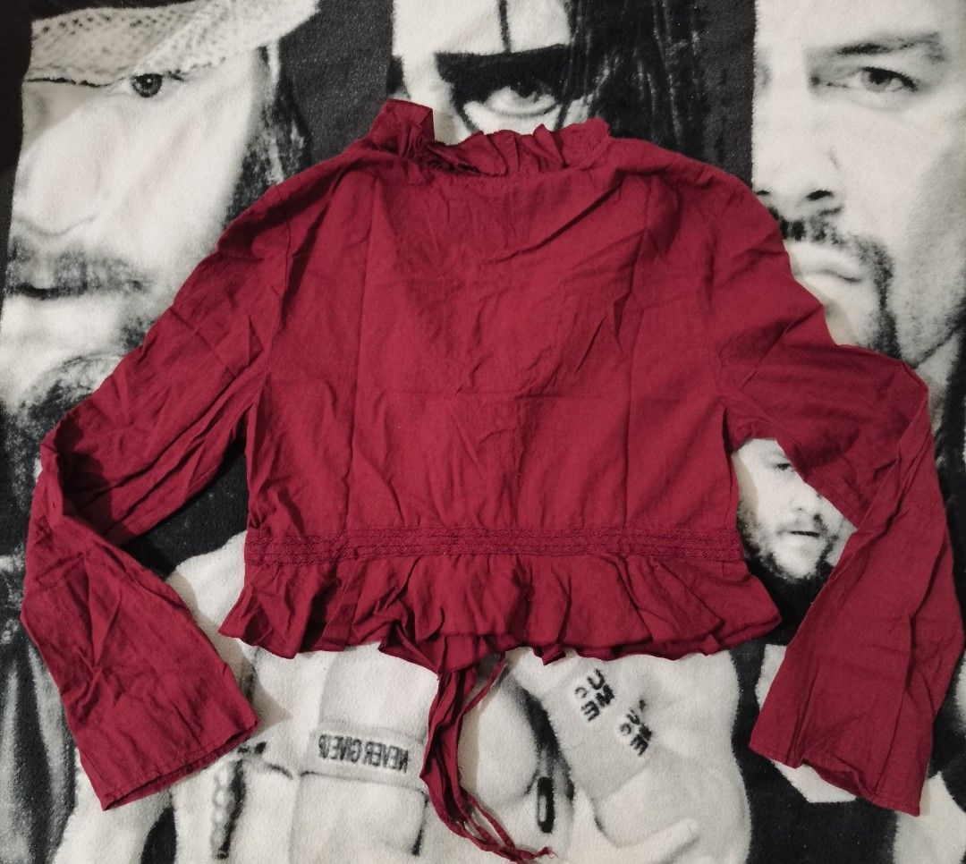 Bershka Red Cropped Tie-Front Blouse (Category: Blouses) located in Santa Cruz. Submitted by oddpenguin-4575 (Listing ID 1441753551, Image 3). Description: 📌.....P L E A S E R E A D..... 📌measurement:Laid flat Sh-17"/Sleeve-25"/Chest-19"/Lenght-19"/armhole-6.5"/armpit-10" 📌Brand:Bershka 📌color-10/10 📌- Red cropped blouse from Bershka - Long bell sleeves - Ruffled collar and hem - Tie-front closure with decorative trim - Estimated size: Mediu