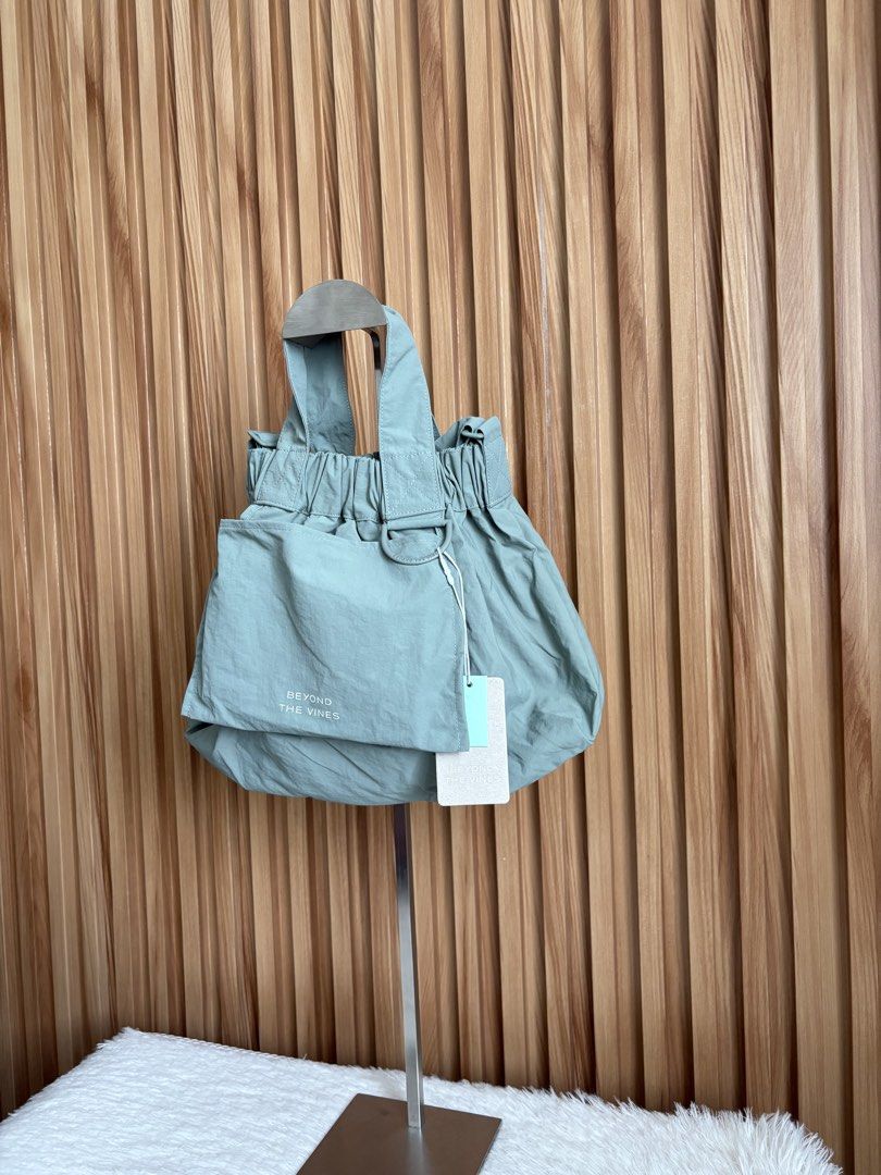 BEYOND THE VINES XS DUMPLING BAG IN SAGE (Category: Cross-body Bags) located in Imus. Submitted by dumpitlikeaqueen (Listing ID 1441604108, Image 3). Description: • With tag • Original Price: 3,790php • Open for layaway • Instagram Shop: @dumpitlikeaqueen.