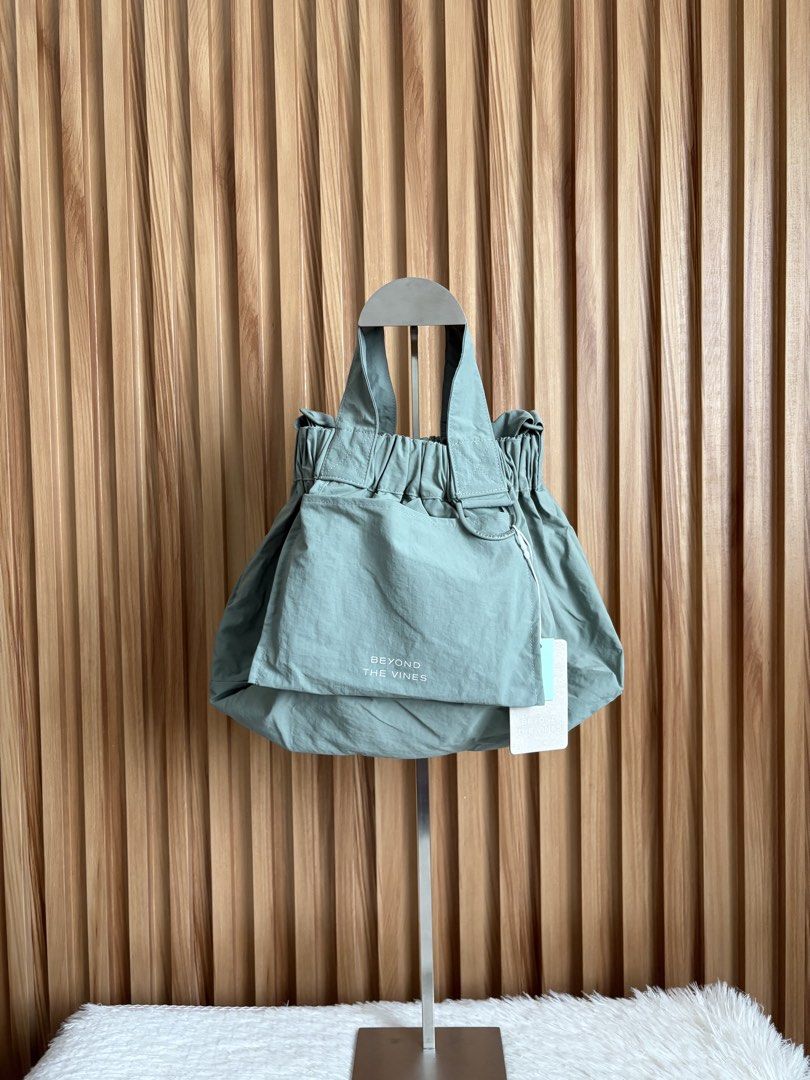BEYOND THE VINES XS DUMPLING BAG IN SAGE (Category: Cross-body Bags) located in Imus. Submitted by dumpitlikeaqueen (Listing ID 1441604108, Image 1). Description: • With tag • Original Price: 3,790php • Open for layaway • Instagram Shop: @dumpitlikeaqueen.