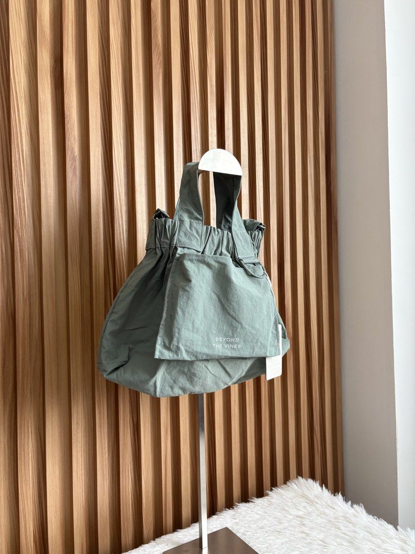 BEYOND THE VINES XS DUMPLING BAG IN SAGE (Category: Cross-body Bags) located in Imus. Submitted by dumpitlikeaqueen (Listing ID 1441604108, Image 2). Description: • With tag • Original Price: 3,790php • Open for layaway • Instagram Shop: @dumpitlikeaqueen.