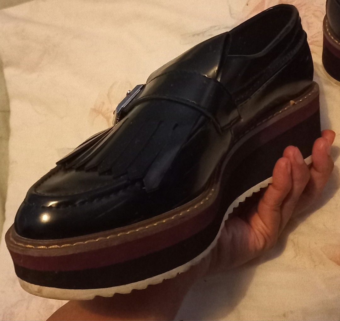 Black Fringed Platform Loafers with Buckle (Category: Loafers) located in Imus. Submitted by mj.trinidad (Listing ID 1441674145, Image 3). Description: 700. Size 37. 6.5 US in Zara Size Chart. Condition is already in the pics. Please check it all. Zara Woman Platform Loafers - Black patent loafers with stylish fringe detail. - Accented with a polished silver buckle. - Chunky platform sole with eye-catching layered colors. - Designed for both styl