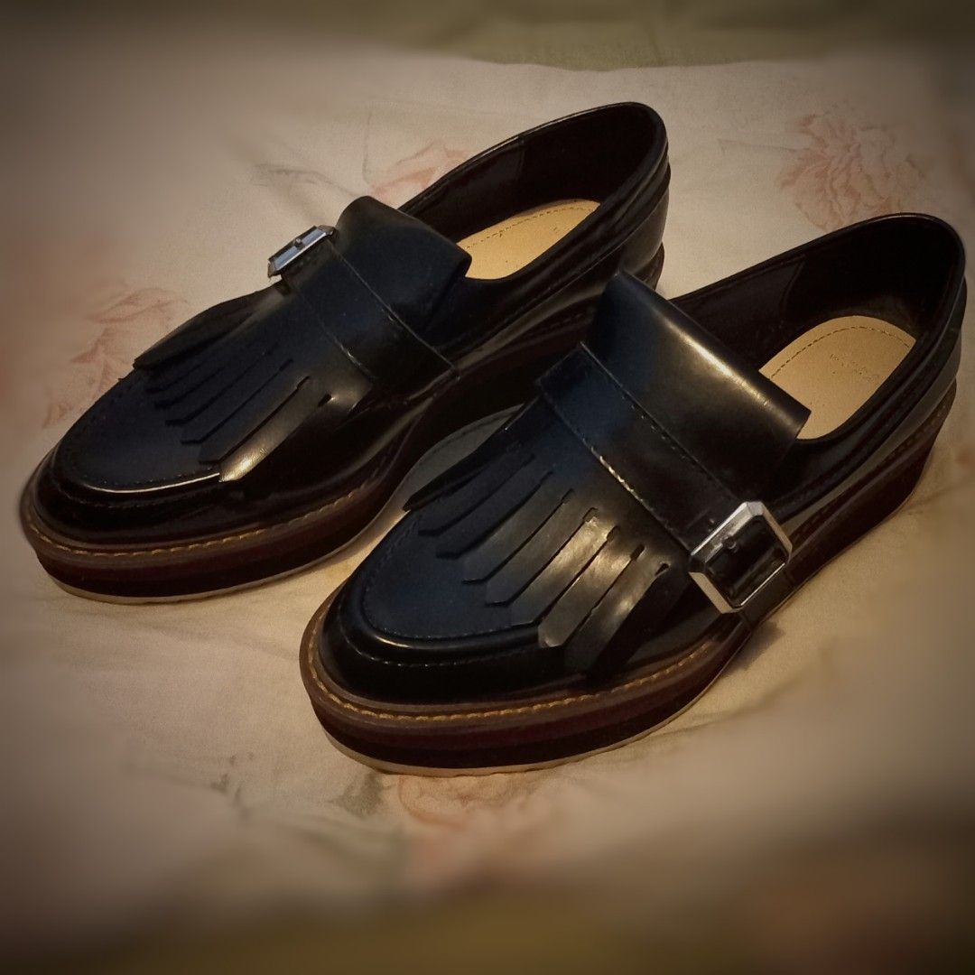 Black Fringed Platform Loafers with Buckle (Category: Loafers) located in Imus. Submitted by mj.trinidad (Listing ID 1441674145, Image 1). Description: 700. Size 37. 6.5 US in Zara Size Chart. Condition is already in the pics. Please check it all. Zara Woman Platform Loafers - Black patent loafers with stylish fringe detail. - Accented with a polished silver buckle. - Chunky platform sole with eye-catching layered colors. - Designed for both styl