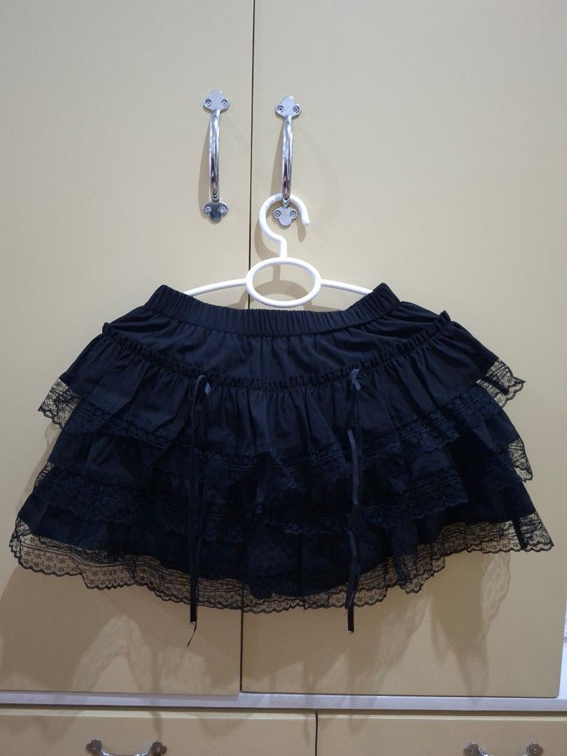 Black Layered Lace Skirt (Category: Skirts) located in Manila. Submitted by preloved_tweeds_ph (Listing ID 1441602465, Image 1). Description: waist: 24 -34 inches length: 13.5 inches - Cute black skirt - Features ruffles and lace trim - Ribbon tie detail at the waist - 3 layers - Versatile and easy to pair with various tops.