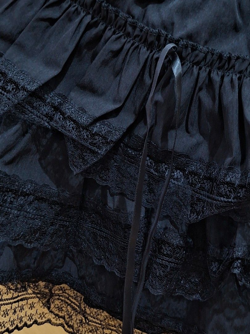Black Layered Lace Skirt (Category: Skirts) located in Manila. Submitted by preloved_tweeds_ph (Listing ID 1441602465, Image 2). Description: waist: 24 -34 inches length: 13.5 inches - Cute black skirt - Features ruffles and lace trim - Ribbon tie detail at the waist - 3 layers - Versatile and easy to pair with various tops.