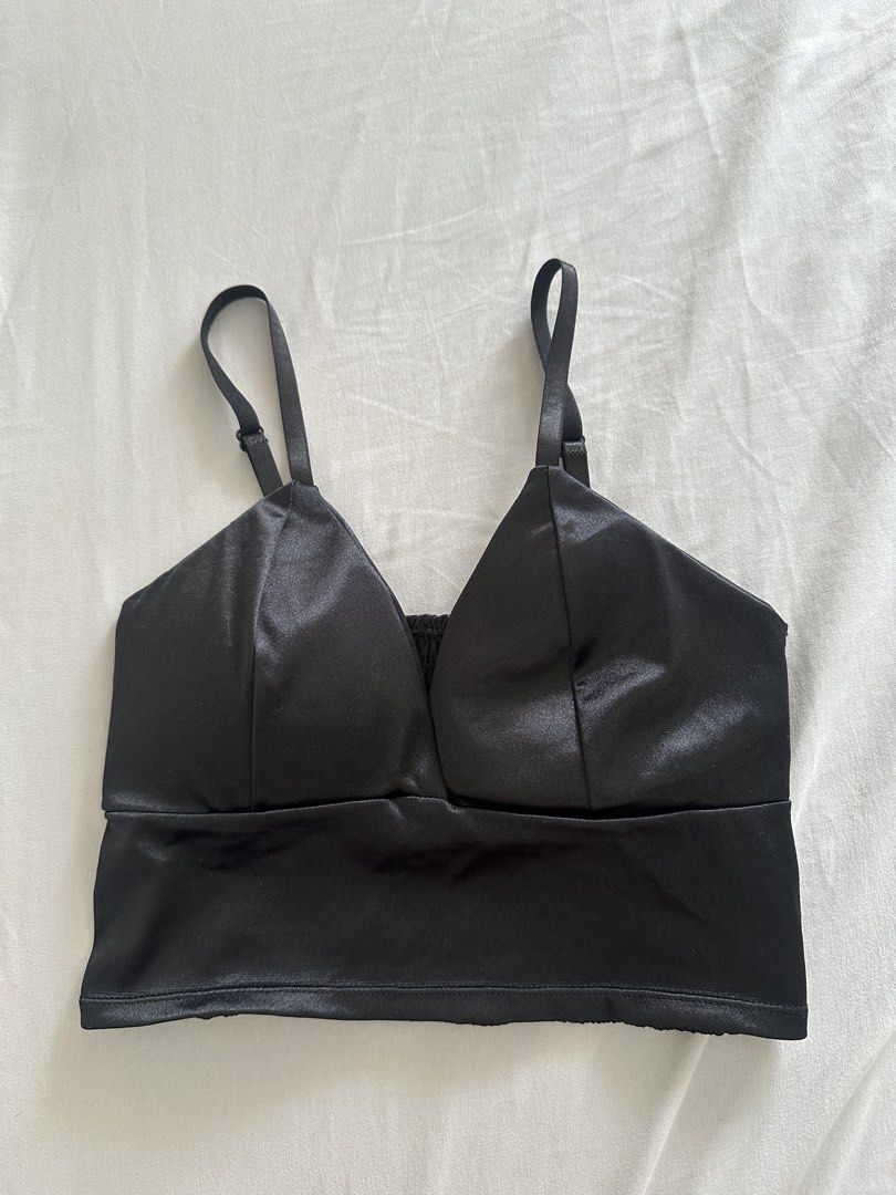 Black Satin Smocked Back Crop Top (Category: Sleeveless) located in Paranaque City. Submitted by declutterwyae (Listing ID 1441625487, Image 1). Description: - Sleek black satin fabric - Adjustable straps for a customized fit - Comfortable smocked back - Perfect for pairing with high-waisted skirts or pants - Easily dressed up or down for any event.