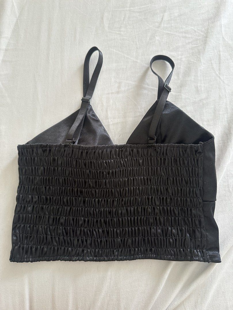 Black Satin Smocked Back Crop Top (Category: Sleeveless) located in Paranaque City. Submitted by declutterwyae (Listing ID 1441625487, Image 3). Description: - Sleek black satin fabric - Adjustable straps for a customized fit - Comfortable smocked back - Perfect for pairing with high-waisted skirts or pants - Easily dressed up or down for any event.