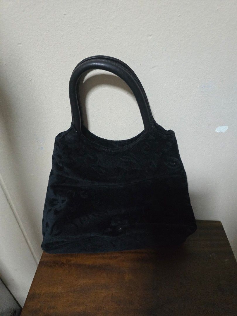 Black Velvet Handbag with Embossed Pattern (Category: Shoulder Bags) located in Singapore. Submitted by graciously16 (Listing ID 1441712978, Image 1). Description: - Black velvet handbag - Elegant embossed pattern all over - Single handle for comfortable carrying - Interior zippered pocket with metal pull tab - 'COMELY' brand detail on zipper pull - Secure magnetic front closure.