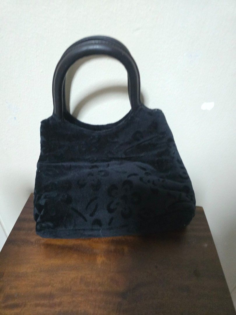 Black Velvet Handbag with Embossed Pattern (Category: Shoulder Bags) located in Singapore. Submitted by graciously16 (Listing ID 1441712978, Image 2). Description: - Black velvet handbag - Elegant embossed pattern all over - Single handle for comfortable carrying - Interior zippered pocket with metal pull tab - 'COMELY' brand detail on zipper pull - Secure magnetic front closure.