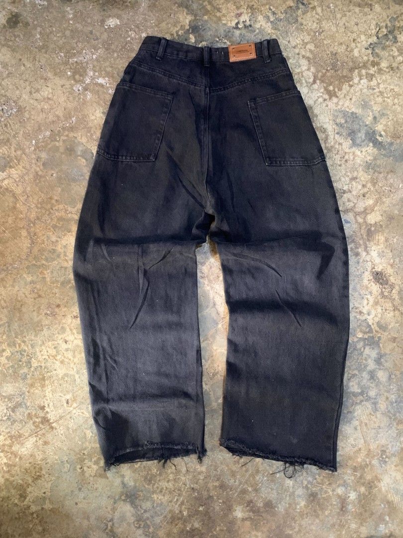 Black Wide Leg Jeans with Raw Hem (Category: Jeans) located in Davao. Submitted by asrielthrift (Listing ID 1441631666, Image 2). Description: - High-waisted black wide-leg jeans - Unique panel stitching on front and back - Raw hem detail - Versatile for streetwear looks - Easy to style with various tops.