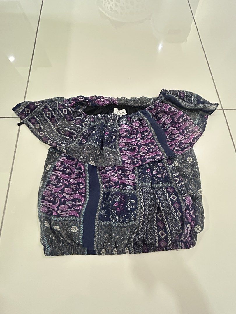 Boho Patchwork Off-Shoulder Blouse (Category: Blouses) located in Subang Jaya. Submitted by relivecorner. (Listing ID 1441644608, Image 1). Description: - Cute off-shoulder design - Patchwork pattern in purple and navy blue - Features paisley and geometric prints - Elasticated hem and neckline for a comfortable fit - Stylish flutter sleeves - Ideal for casual wear, beach trips, or a relaxed day out - PREFER PICKUP / MEET-UP - PRICE IS NOT INCLUDE